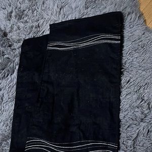 Black table runner with white and grey embroidered lines